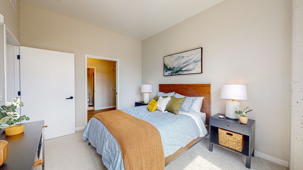 a bedroom with a bed and two night stands