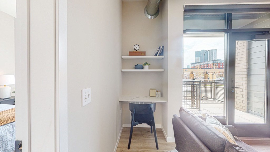 a small desk in the corner of a room