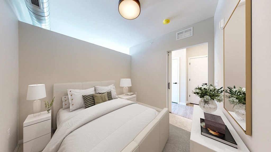 a bedroom with a large bed in a room