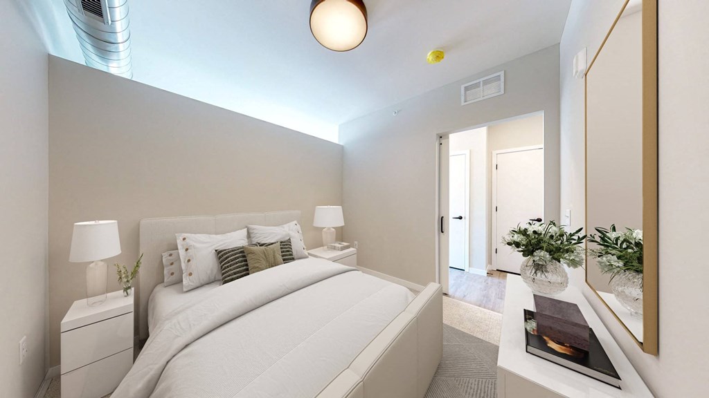 a bedroom with a large bed in a room