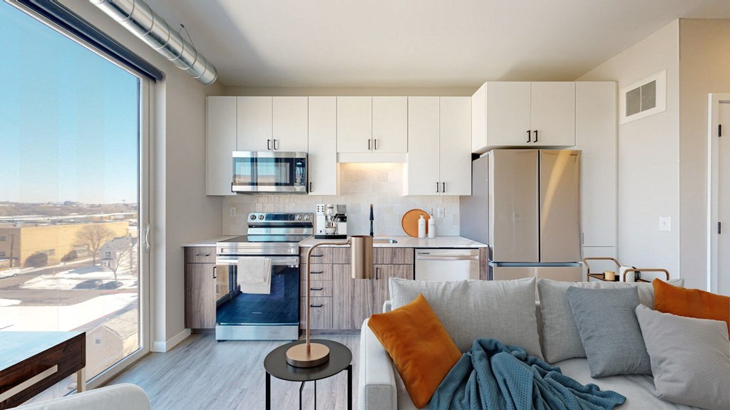 a living room with a couch a table and a window