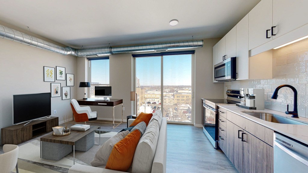 a kitchen and living room in a 555 waverly unit