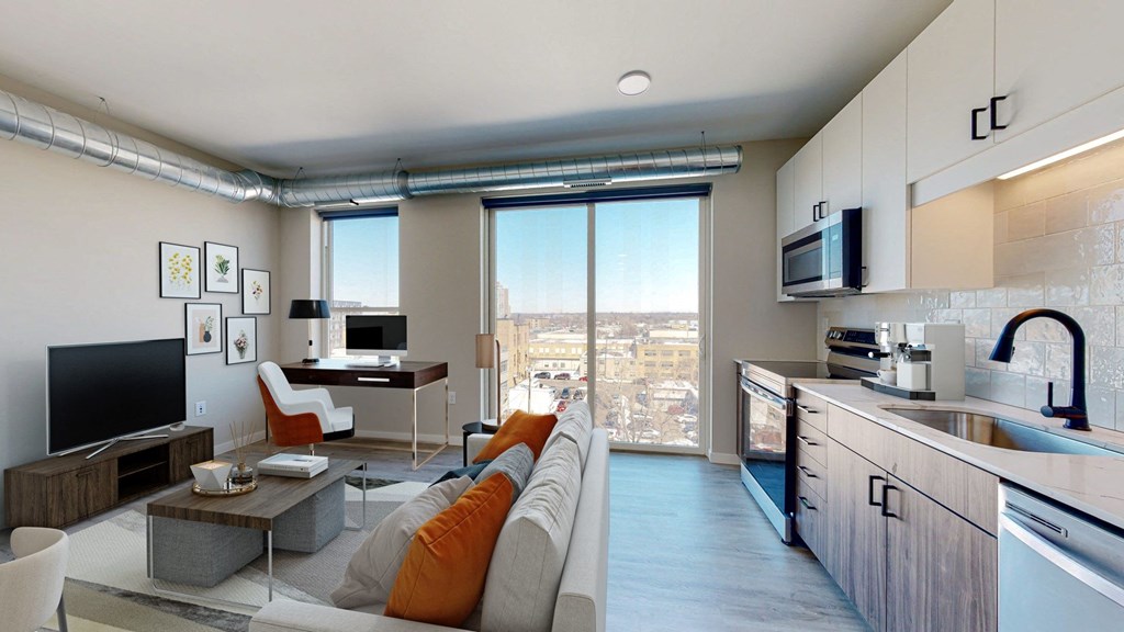 a kitchen and living room in a 555 waverly unit