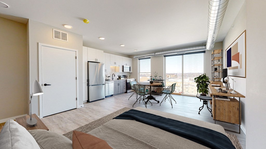 a bedroom with a large bed in front of a window