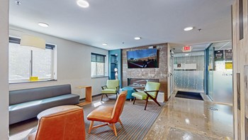 resident lounge with fireplace and tv - Photo Gallery 18