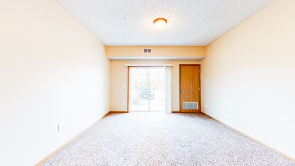 spacious living room with balcony