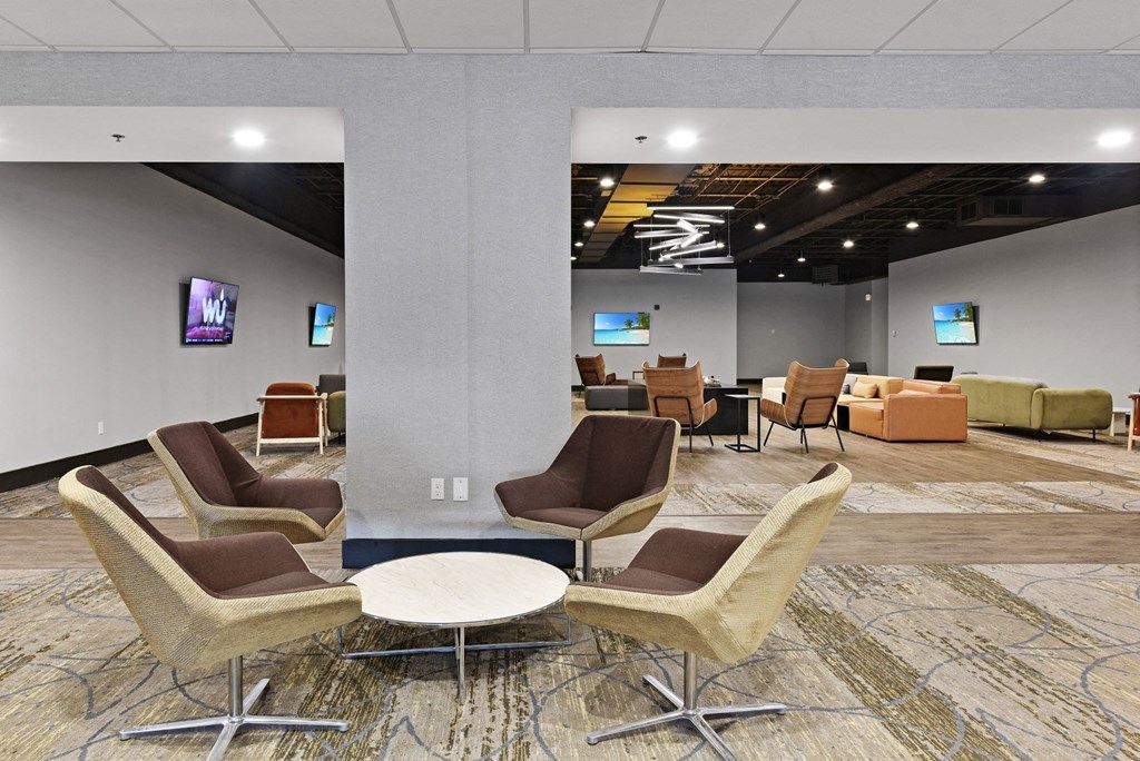 a large room with chairs and couches