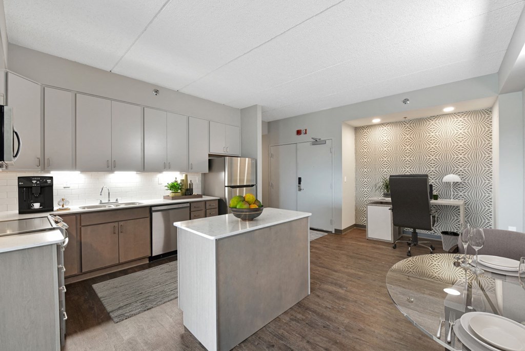 a kitchen and dining area in a 555 waverly unit