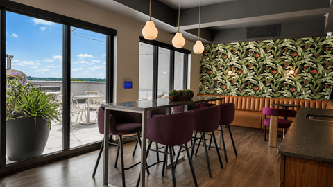 A dining area with a table and chairs.