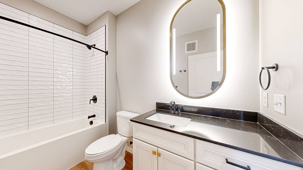 a bathroom with a sink toilet and a shower at Ardor on the Bluffs South Loop Residences Apartments, Bloomington, MN, 55425