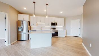 Modern Kitchen With Stainless Steel Appliances And Double Door Refrigerators at Arris Apartments - Now Open!, Lakeville, Minnesota