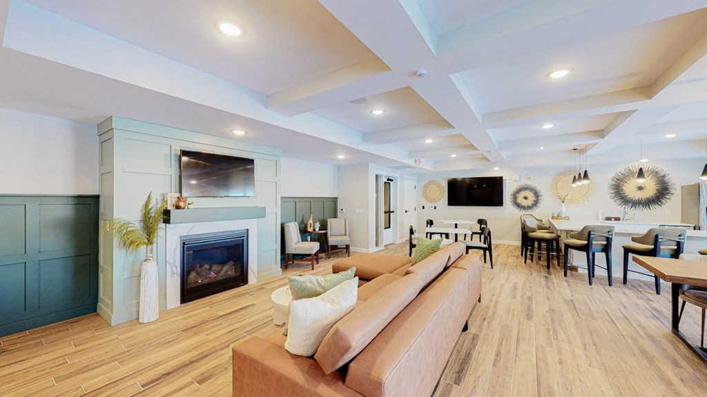 a living room with a fireplace and a tv