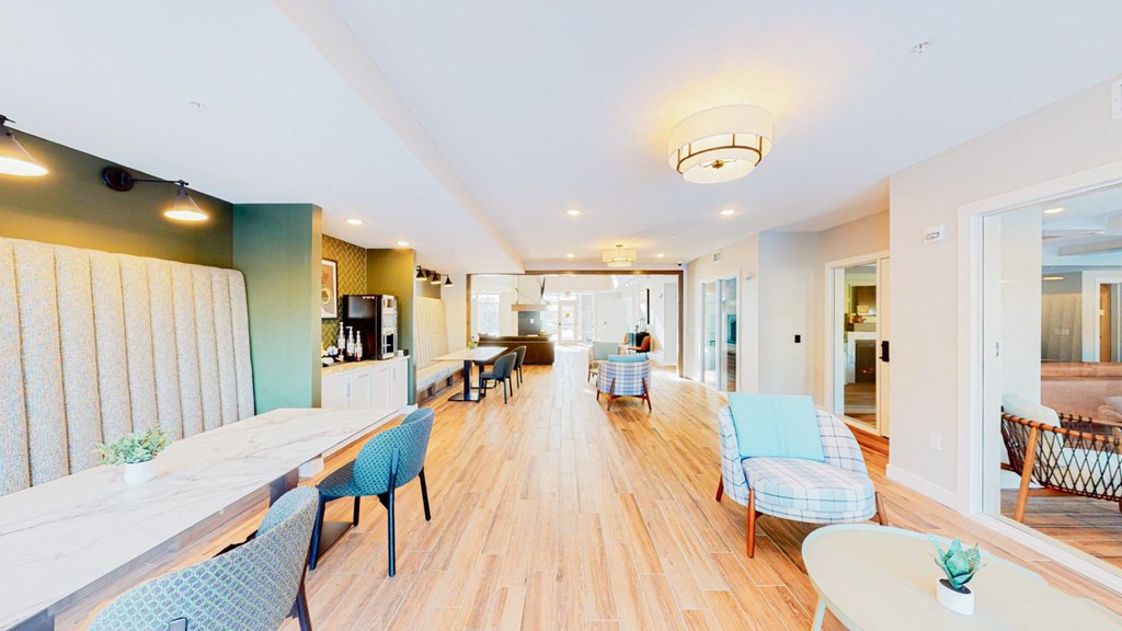 a communal area with tables and chairs