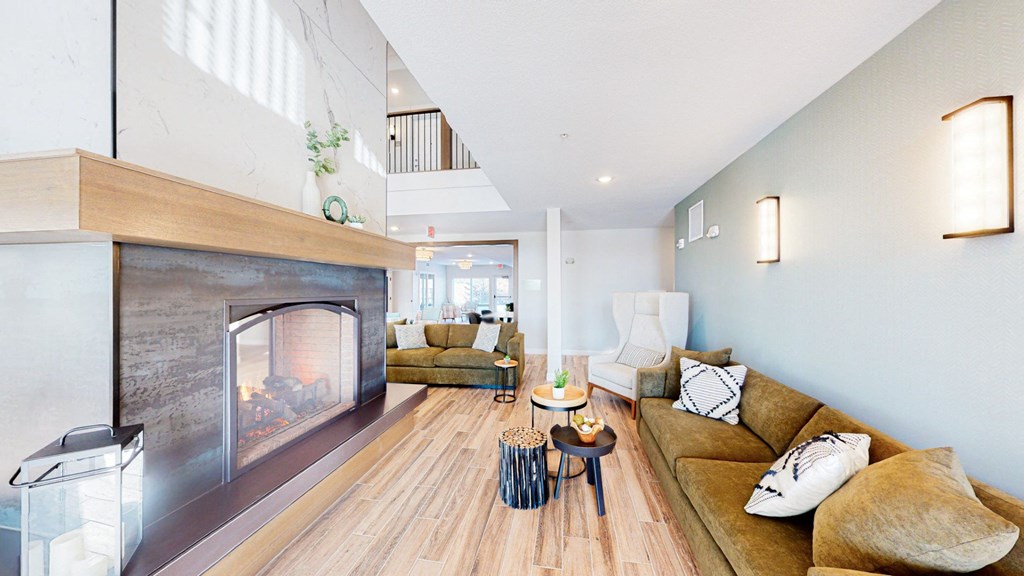 a living room with a fireplace and couches