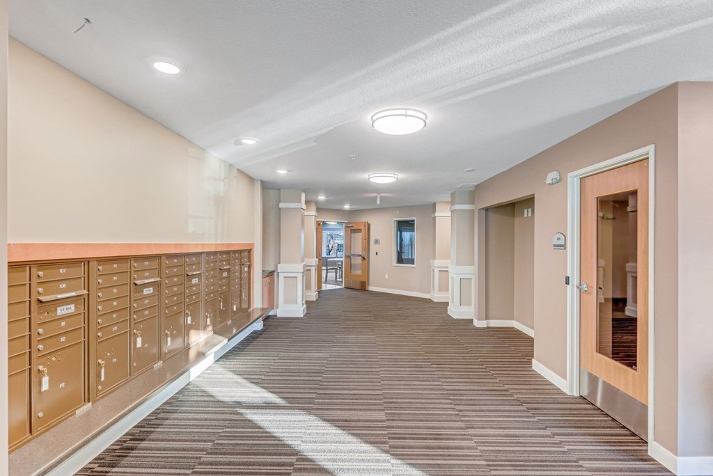 a long hallway with wooden floors and wooden cabinets