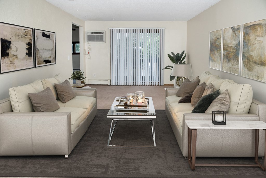 a living room with couches and a coffee table