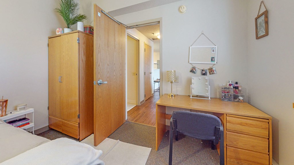 a small room with a desk and a chair