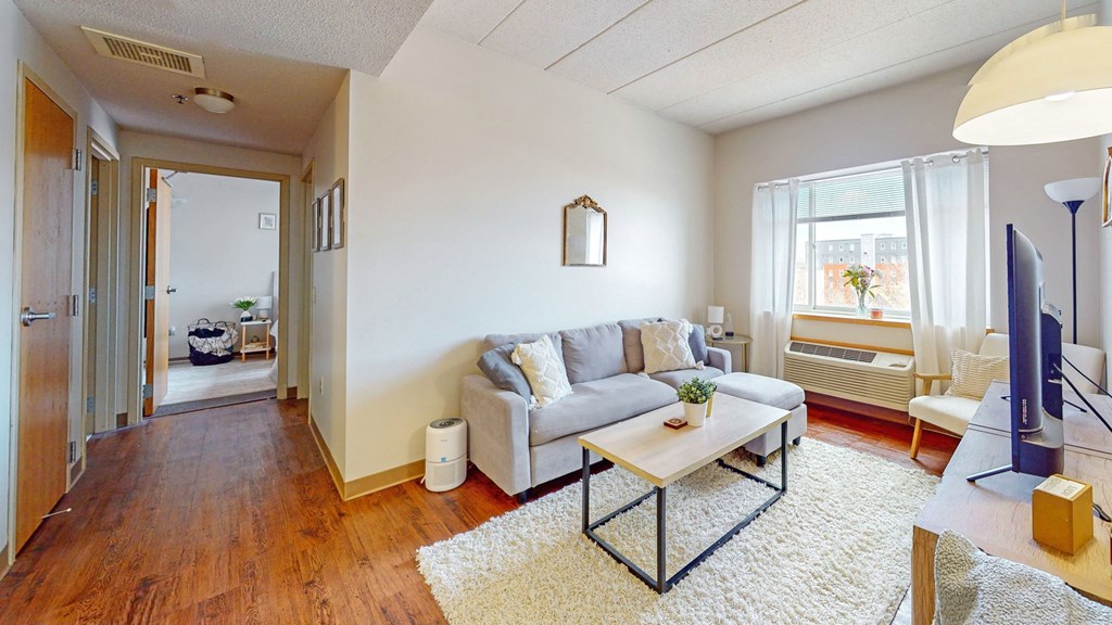 a living room with a couch and a table