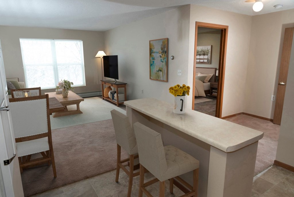 a view of the living room from the kitchen  at Briarcliff Apartments, a 55+ Community, Mahtomedi, MN, 55115