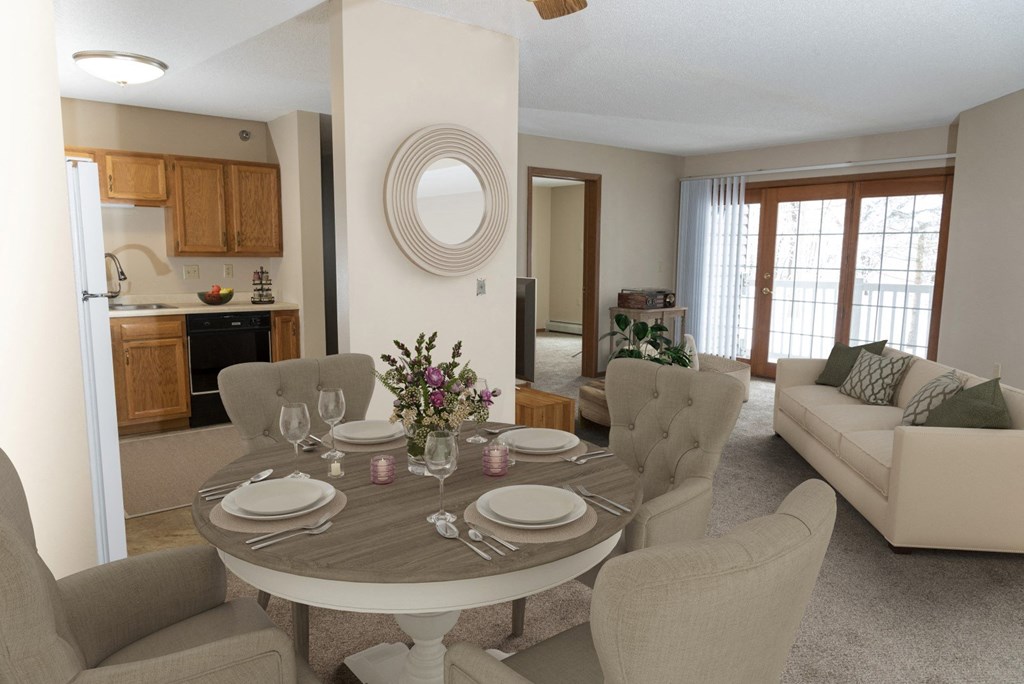a dining area with a table and chairs and a kitchen in the background  at Briarcliff Apartments, a 55+ Community, Mahtomedi, Minnesota  at Briarcliff Apartments, a 55+ Community, Mahtomedi, MN