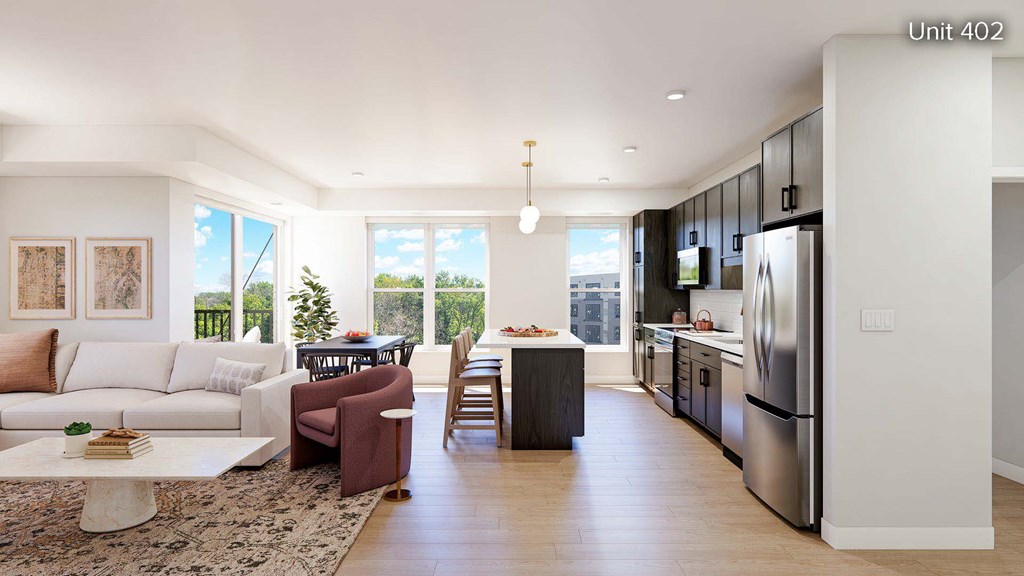 A modern kitchen with a refrigerator, sink, and cabinets.