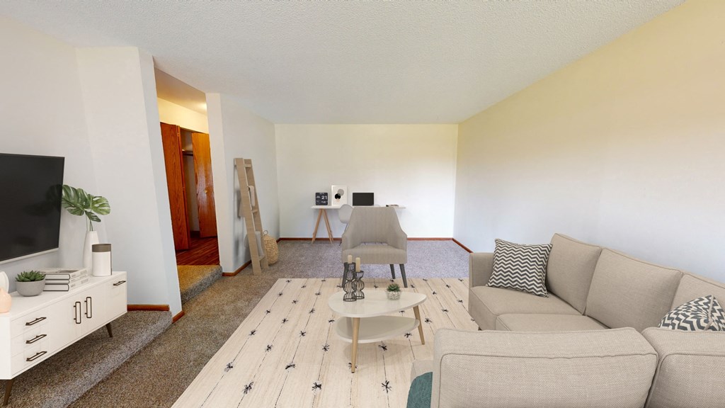 a living room with a couch and a table