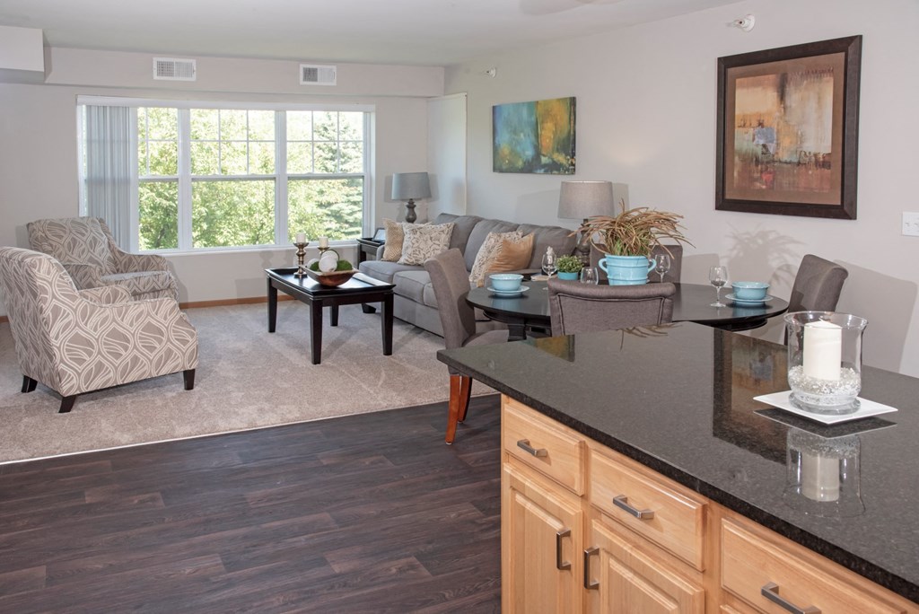 model apartment, kitchen island looking towards living room
