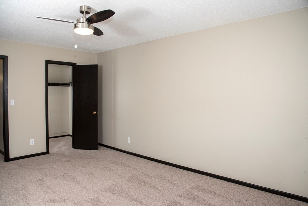 One bedroom with ceiling fan and large closet