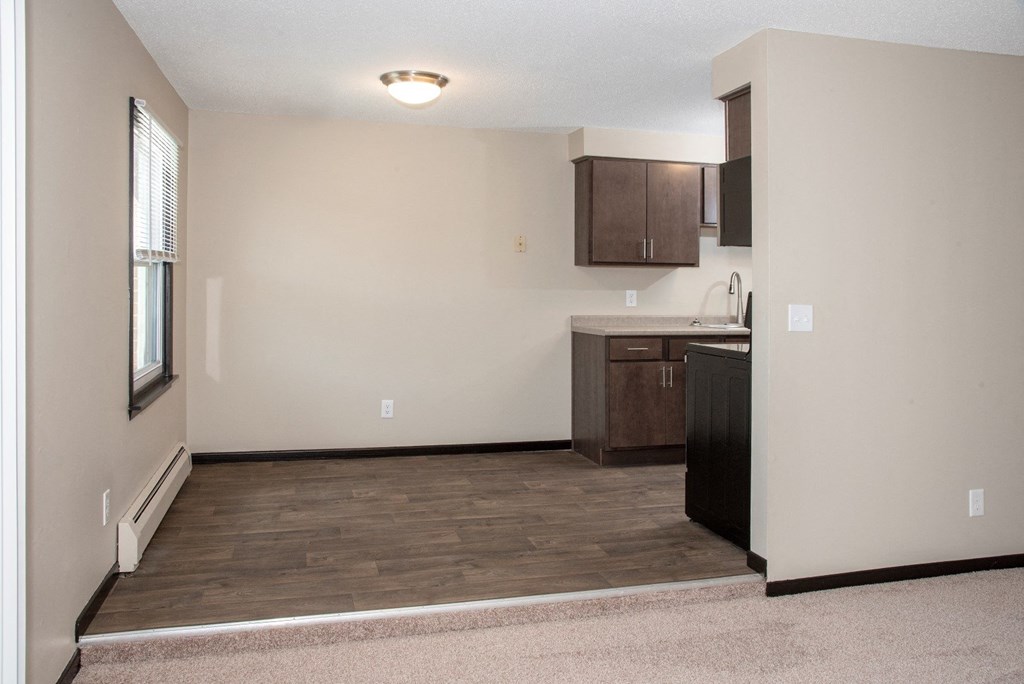 Seperate dining area with wood look flooring