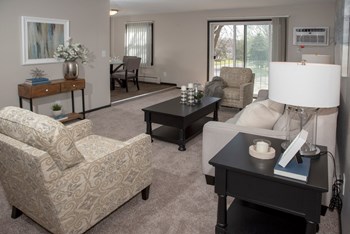 one plus den model, living room with view of balcony and dining area - Photo Gallery 2