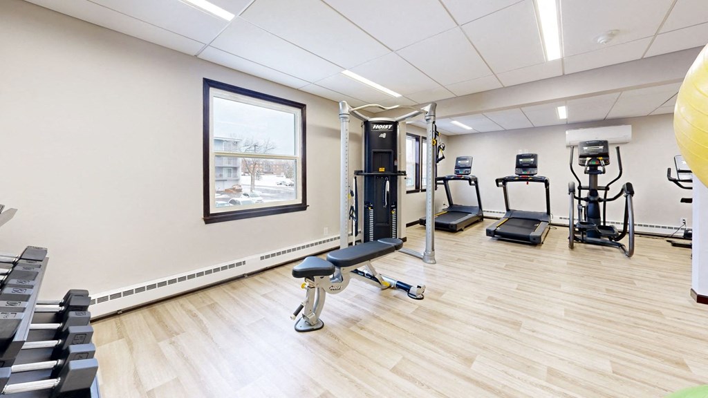 fitness center with cardio and lifting equipment