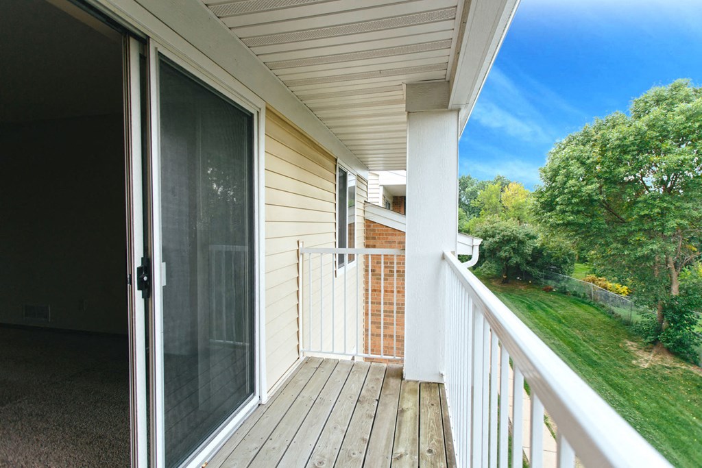 Large balcony with great views of our beautiful grounds at Cinnamon Ridge Apartments, Minnesota, 55122
