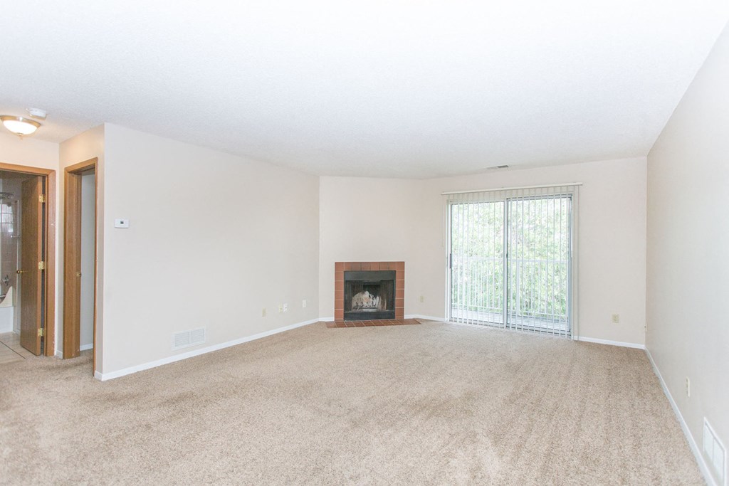 2 bedroom apartment living room with balcony and fireplace at Cinnamon Ridge Apartments, Eagan, MN, 55122