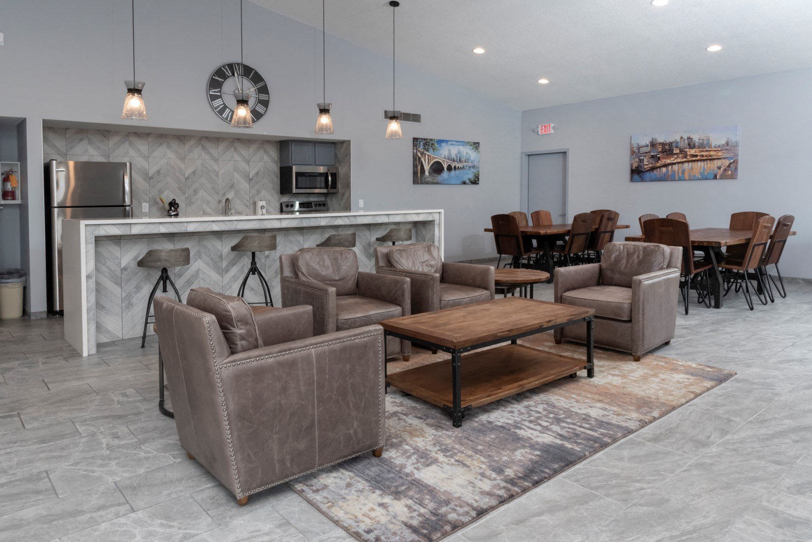 a living room with couches and chairs and a table