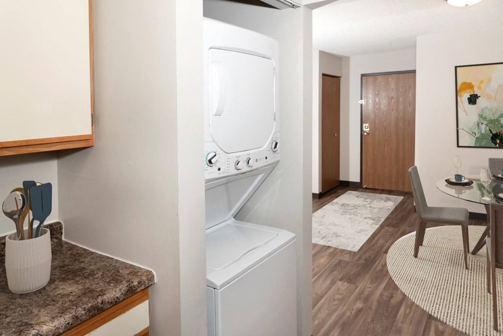 a room with a washer and dryer in it