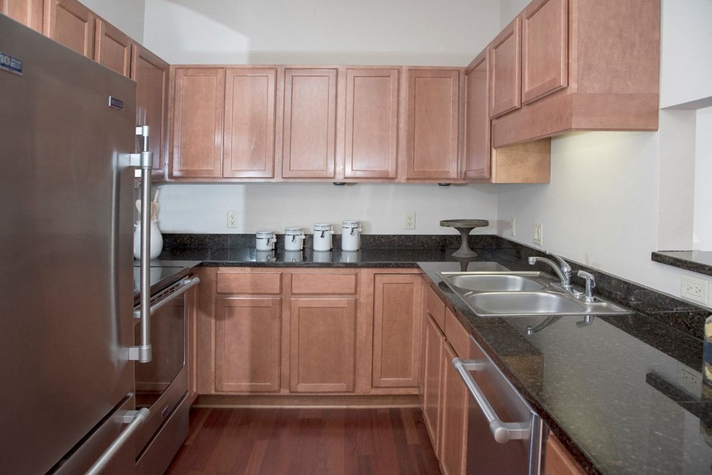 kitchen with stainless steel appliances, granite countertops