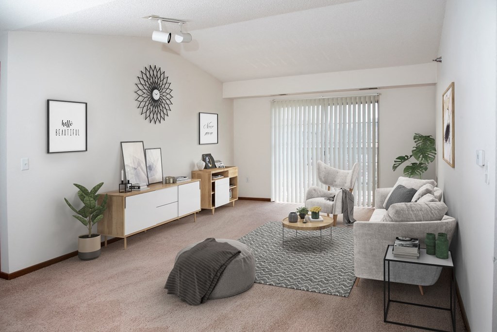 the living room of an apartment with a couch and a table