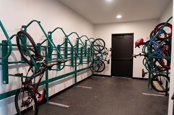 A bike rack with many bikes parked.