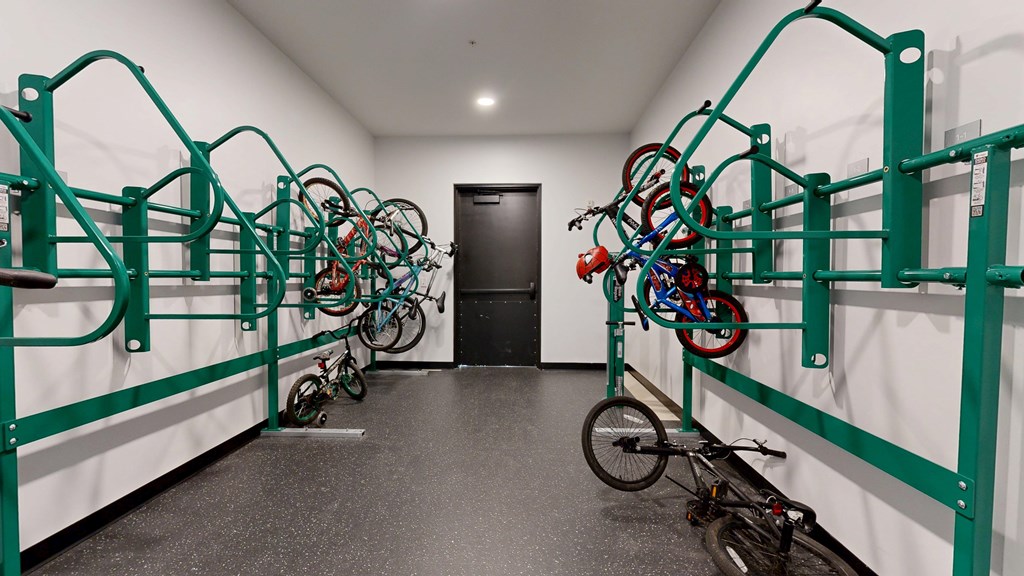 A bike rack with many bikes parked in it.