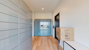 A long hallway with a box on the floor.