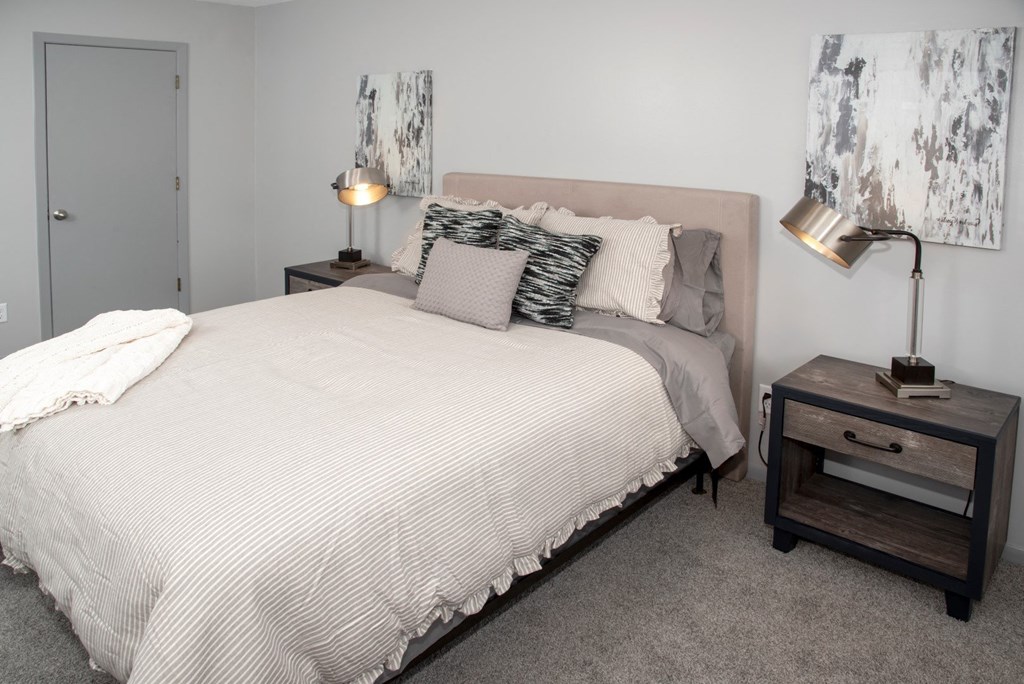 Bedroom 2 with bedroom set, night stands and walk in closet