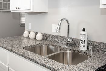 Granite countertops with new plumbing fixtures
