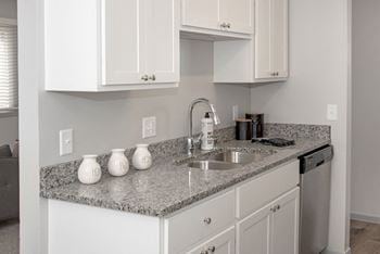 new white cabinetry, granite countertops, full appliance package