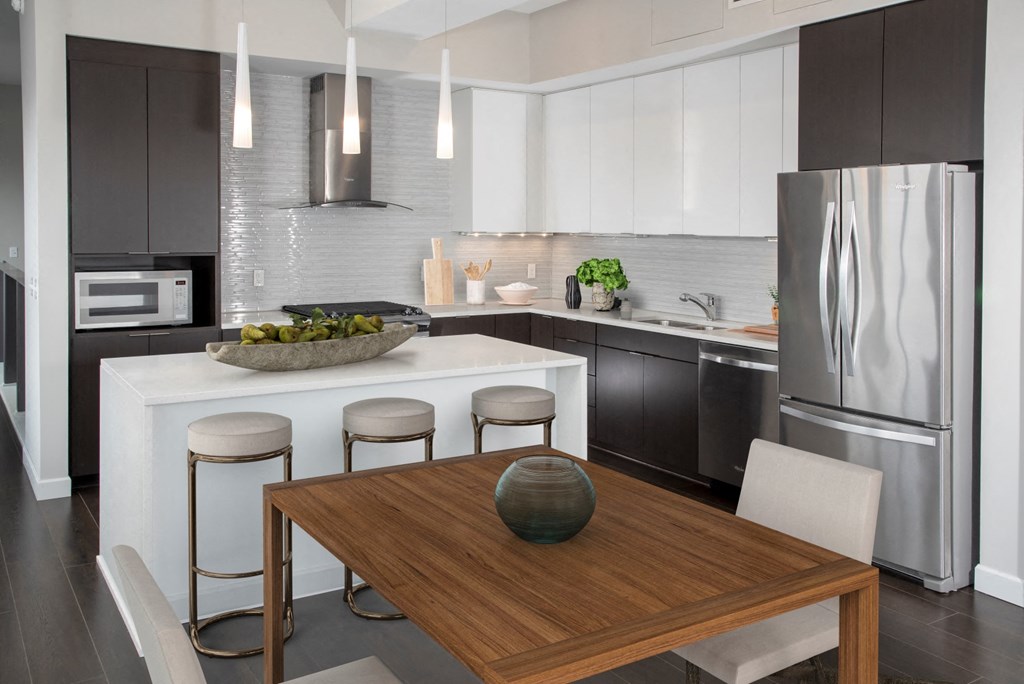 Kitchen with dining area at Custom House penthouse, St Paul