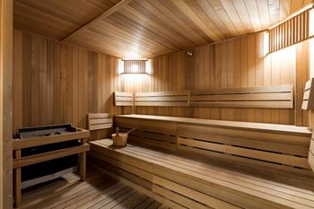 a sauna with wooden walls and floors