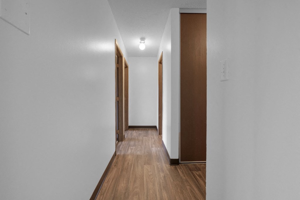 a bedroom with a medium sized bed and a window