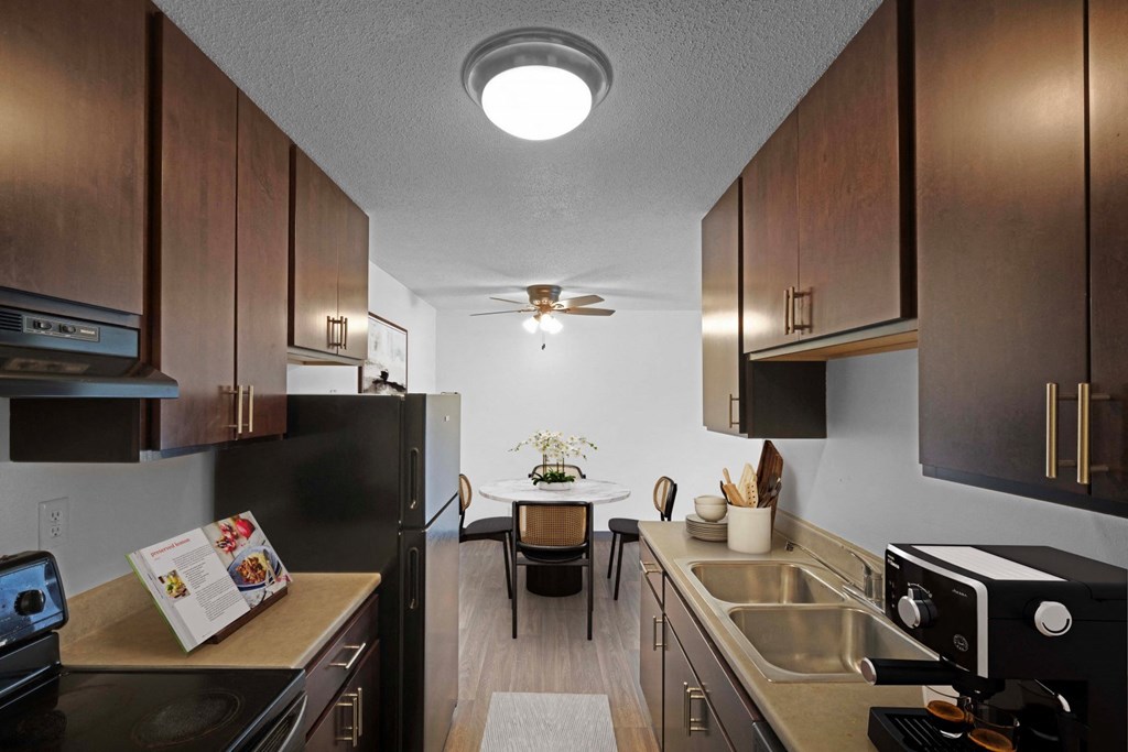 a kitchen and dining area in a 555 waverly unit