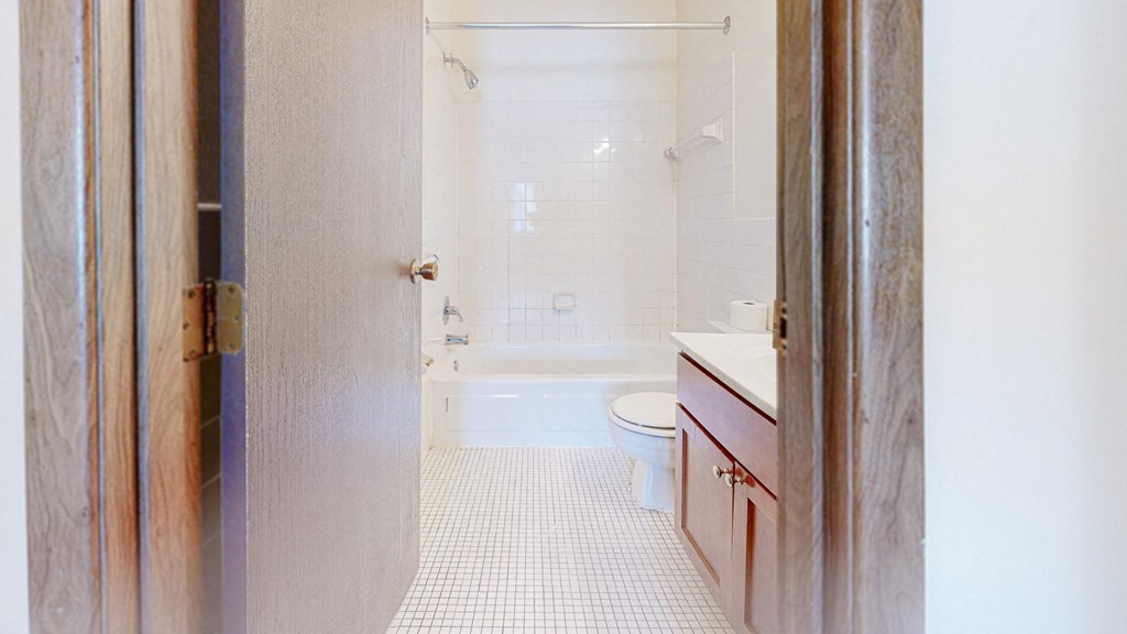 a bathroom with a toilet sink and bathtub