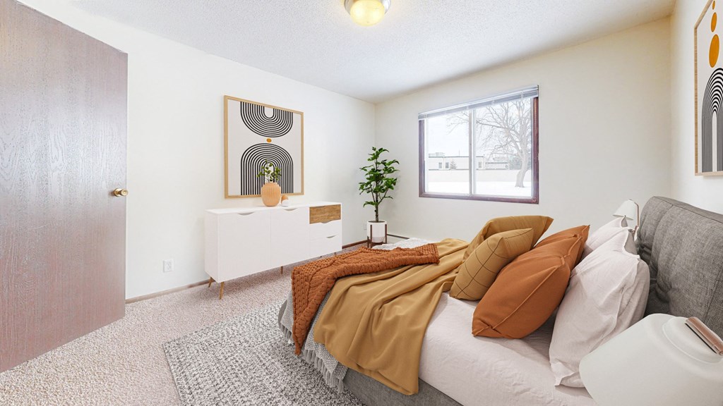 a bedroom with a large bed and a large window