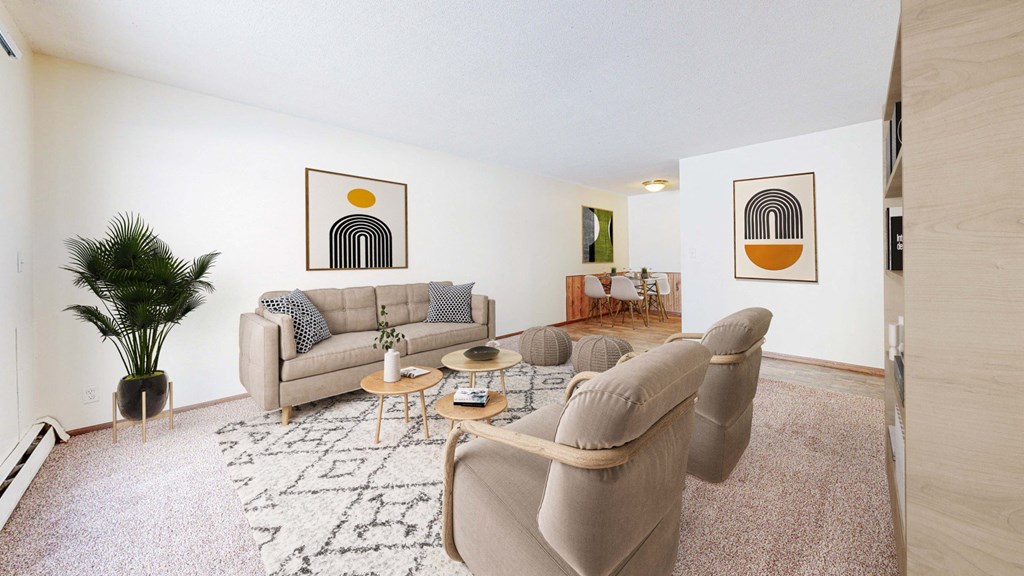 a living room with two couches and two chairs